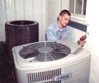 HVAC technician servicing a central air conditioner