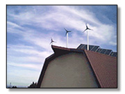 barn with wind turbines & solar panels