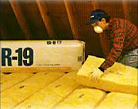 R-19 insulation being installed in an attic